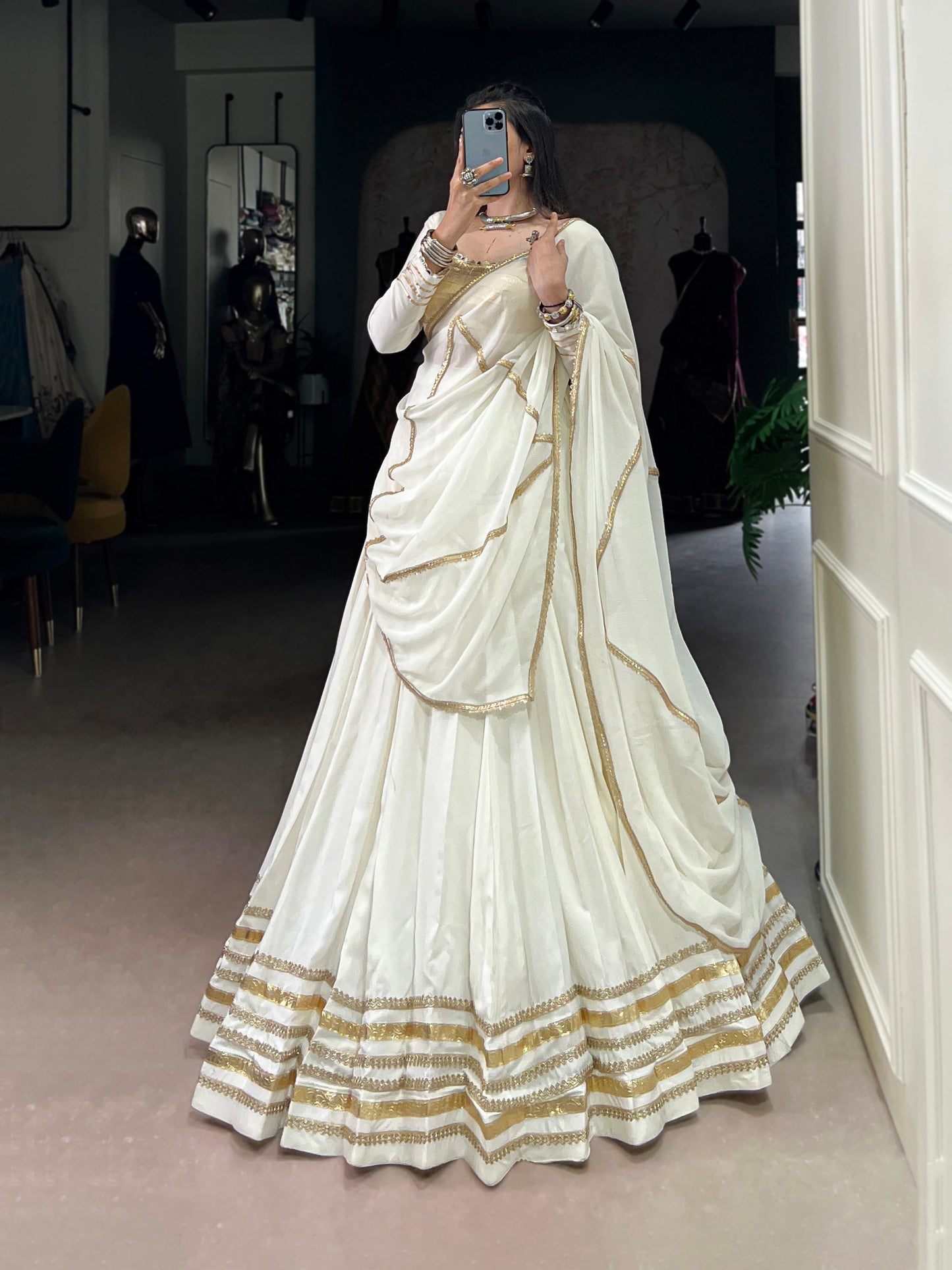 Rhea’s Ethereal Look White & Gold Flow Lehenga Set for Regal Evenings