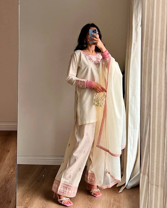 Ivory Whisper: Soft Elegance in Hand-Embroidered Pastel Pink Threads