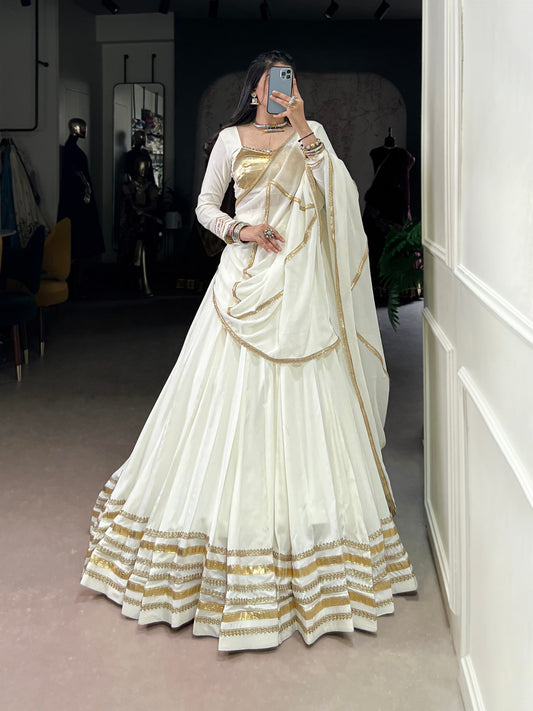 Rhea’s Ethereal Look White & Gold Flow Lehenga Set for Regal Evenings